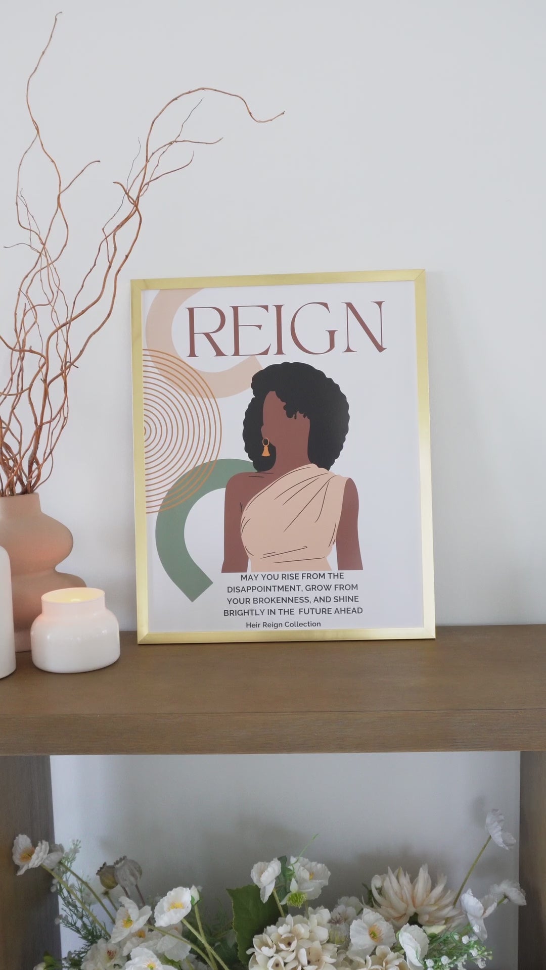 Beautiful wall art illustration of a black woman with an afro hair style with a soft pink top and inspirational positive affirmation. The picture is in a  gold frame with beautiful home decor.
